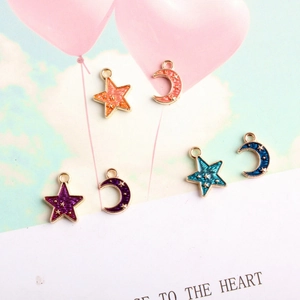 Detail of colorful star and moon enamel pendants with gold plating for DIY jewelry making