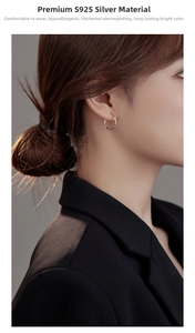 Close-up of S925 sterling silver hoop earrings with twisted rope texture on a female model