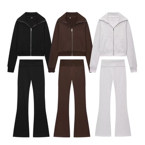 Women's two-piece tracksuit set with zip-up fleece sweatshirt and high waist flare pants