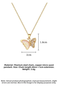 Macro shot of pink butterfly pendant with dimensions 2x1.8cm and 40+5cm chain length