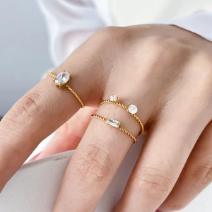 Three-piece stackable 18K gold plated rings with twisted rope bands and diverse zircon stones