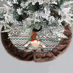 Knitted Christmas tree skirt featuring snowflake patterns, gnomes, and brown faux fur trim