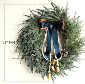 Detail of 18 inch Christmas wreath with blue bow, frosted pine needles and gold bells