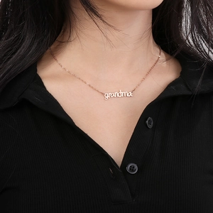 Rose gold grandma necklace worn by a model showcasing the detailed pendant design