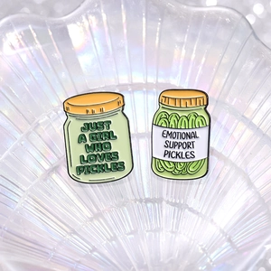 Set of two green enamel pickle jar brooches featuring funny pickle themed text quotes
