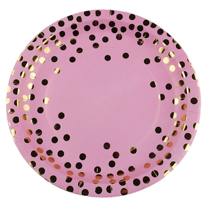 Pink disposable paper plates with elegant gold foil polka dots for party table decor