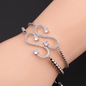 Fashion silver adjustable infinity bracelet with white zircon stones on woman's wrist