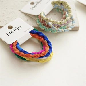 Detail of woven and ribbed hair bands in assorted candy colors with card packaging