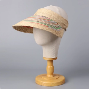 Foldable raffia open top sun hat with colorful ribbon trim on a display mannequin