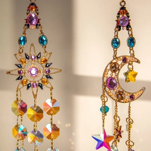 Golden sun and moon crystal suncatcher with colorful enamel and rainbow prisms