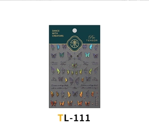 Macro detail of laser butterfly nail art stickers with bow designs on premium packaging