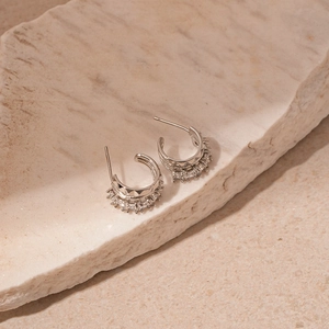 Elegant geometric C-shaped hoop earrings with silver plating and sparkling zircons