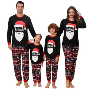 Christmas family pajama set with Believe Santa print and festive patterned pants