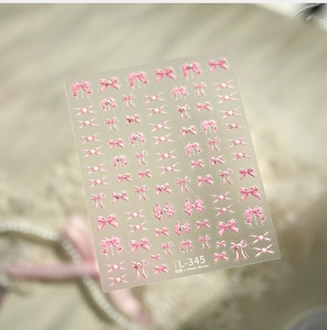 Macro detail of 5D embossed pink bow nail art stickers with 3D relief texture TL-345