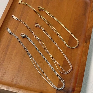 Close-up of 18k gold plated double layer snake chain bracelet showing S.STEEL stamp