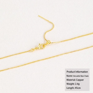 Detailed view of 18k gold-plated copper adjustable box chain with needle end