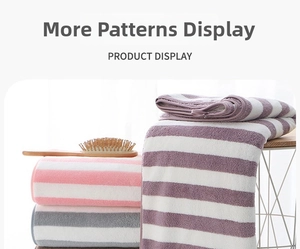 Detail showing plush coral fleece towels in pink, purple, and grey striped patterns