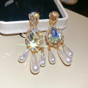 Vintage gold plated earrings with pear-cut crystals and teardrop pearl tassels