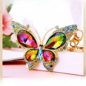 Detail view of colorful crystal butterfly keychain with vibrant rhinestones and gold alloy