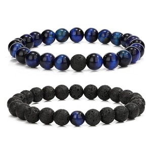 Detailed close-up of 8mm blue tiger eye and black volcanic stone beaded bracelet set