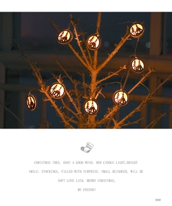 Close-up of Nordic wooden LED string lights featuring warm glowing church silhouettes