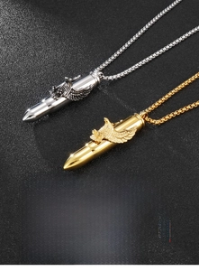 Detail of gold and silver bullet pendants with eagle wing engraving on ball chains