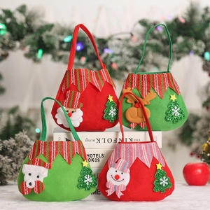 Detail of four festive Christmas felt gift bags with Santa, reindeer, and snowman designs