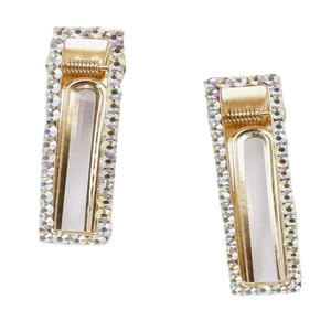 Pair of gold rectangular hair clips with shimmering AB rhinestones on a white backdrop