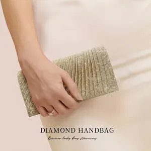 Elegant gold pleated evening clutch bag with sparkling glitter finish for parties