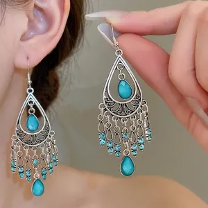 Vintage bohemian silver teardrop earrings with turquoise stones and rhinestone tassels