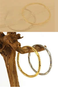Close-up of bamboo-style beaded stainless steel bracelets in gold and silver finish