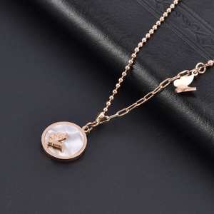 Rose gold necklace with white shell butterfly pendant and elegant mixed chain design