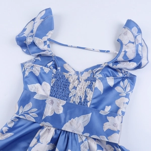 Detail of light blue floral satin dress with elastic shirring and side zipper