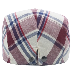 Detail view of cotton plaid beret with adjustable metal snap buckle at the back