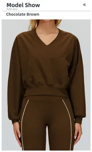 Front view of chocolate brown cropped V-neck hoodie and matching slim-fit sports pants