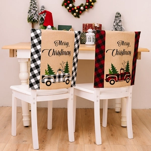 Christmas chair covers featuring plaid patterns and vintage truck motifs in a cozy home setting