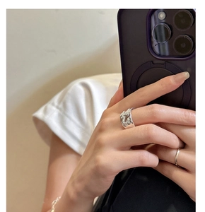 Fashionable S925 silver wide lava texture ring and minimalist band on model's hand