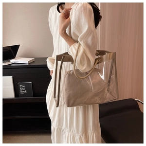 Detailed shot of transparent PVC tote bag with canvas inner pouch and hemp rope handles