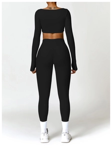 Rear view of tight black long sleeve yoga set featuring scrunch butt gym leggings