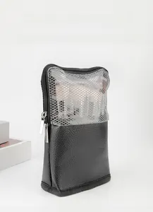 Detailed view of the double zipper and mesh compartment on this makeup brush organizer