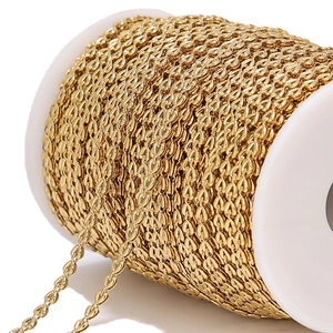 Macro detail of 4mm gold stainless steel heart chain wrapped on a white plastic spool