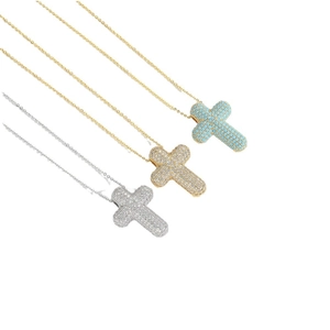 Three elegant cross pendant necklaces in gold and silver with zircon and turquoise inlay