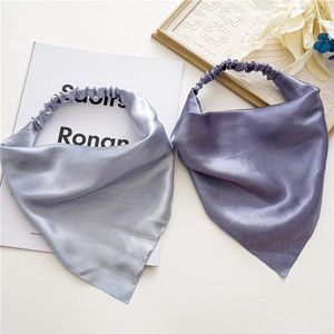 Detailed view of silver-grey and violet satin headscarf bands with silky elastic texture