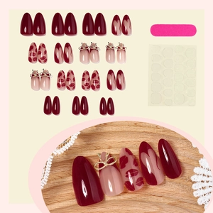 Red heart Valentine press-on nails set with 24 pieces and gold bow accent