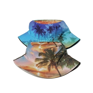 Reversible bucket hats with tropical palm tree sunset prints in gradient blue and orange