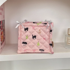 Pink quilted fabric organizer mat with cute cat and pear pattern with satin bows