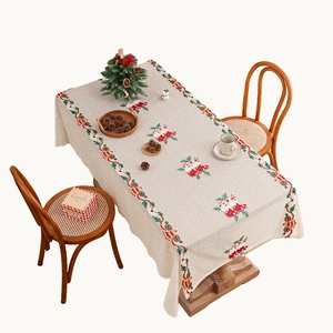 Christmas tablecloth with Santa socks and bells print on cream linen for holiday decor
