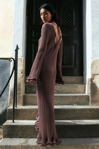 Detail of the back cutout and lace-up design on a ribbed knit long sleeve dress