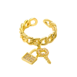 Detail of Cuban chain ring with sparkling pave crystals lock and key charm pendants