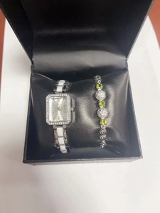 Elegant square silver watch with ceramic strap and matching gemstone bracelet in gift box